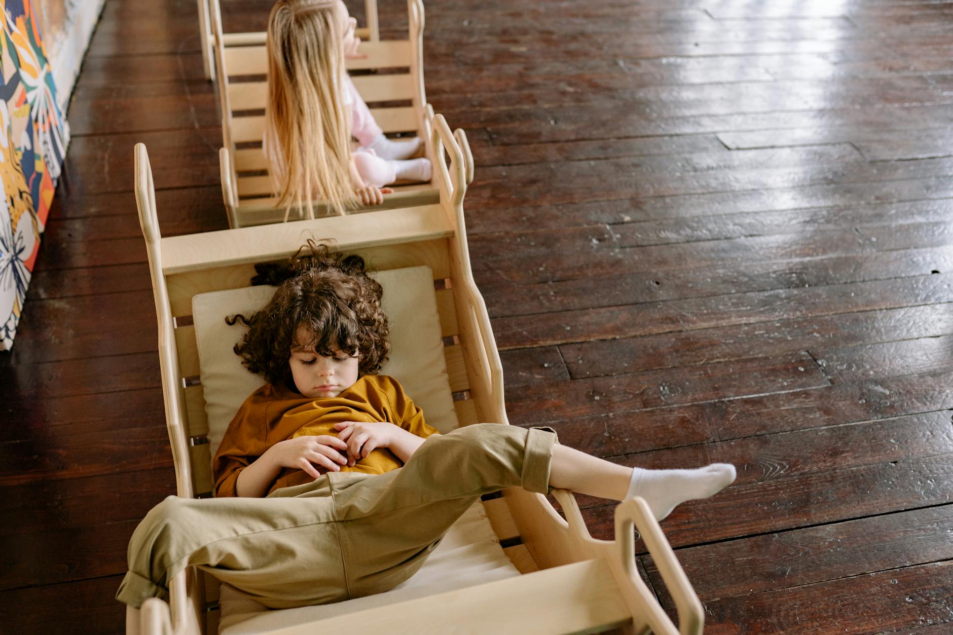 a young boy lying down on a chair child adhd and autism assessment in texas