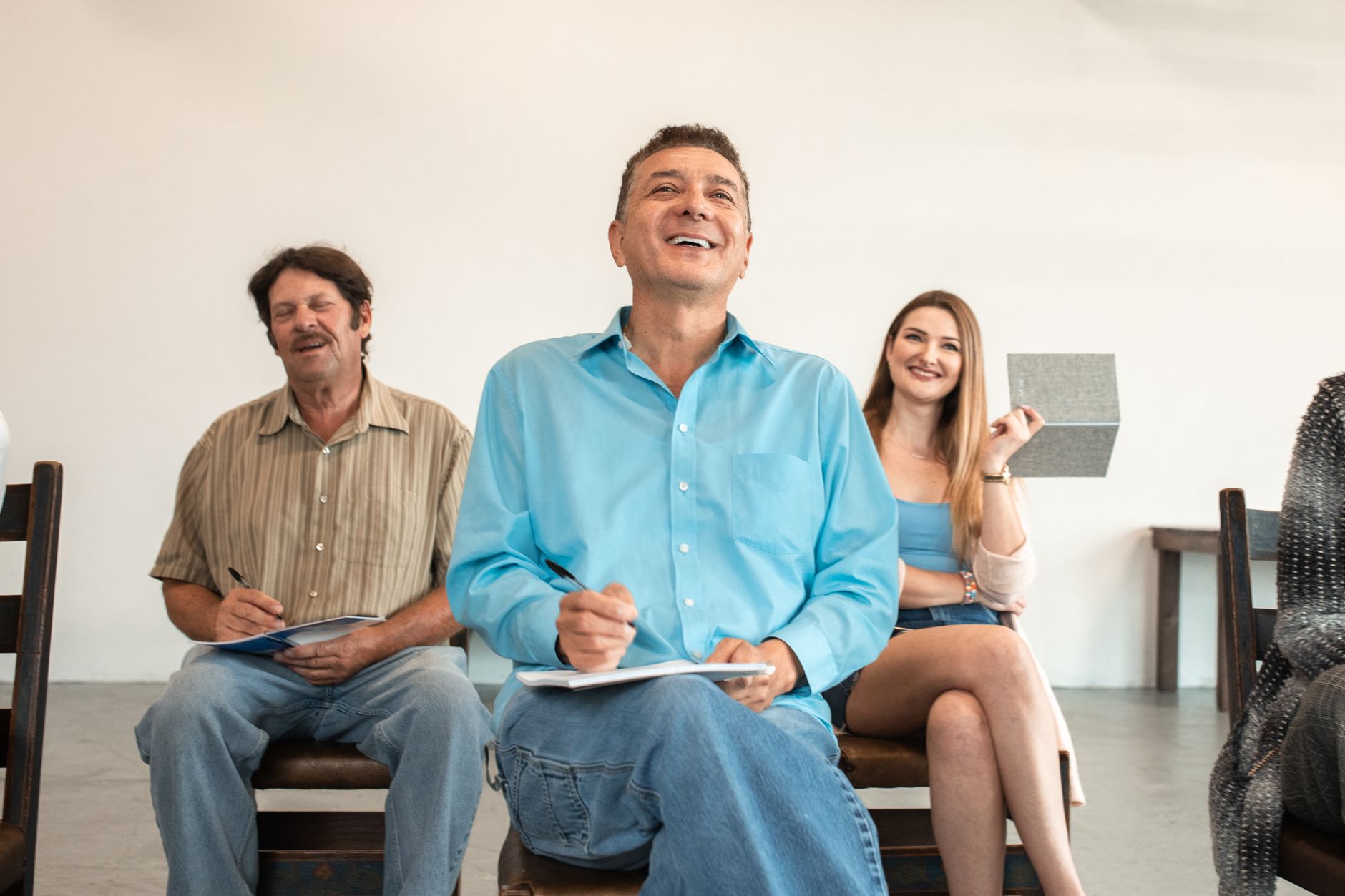 people sitting laughing in a classroom
